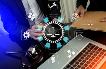 Concepts of Law and Legal services. Lawyer working with law interface icons. Blurred background.	
