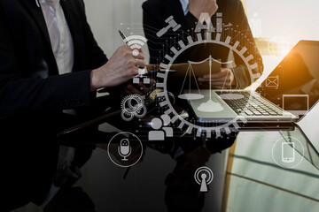 Concepts of Law and Legal services. Lawyer working with law interface icons. Blurred background.