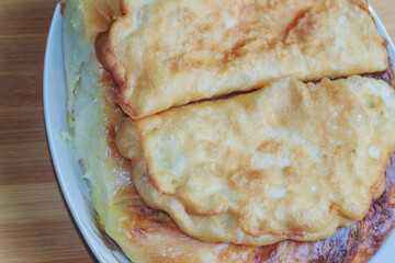 pie with cottage cheese on a plate, national Moldovan food