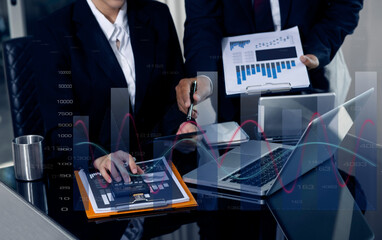 Businessman hands working on network and digital finance marketing chart with future technology innovation and digital transformation concept.
