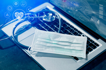 Fototapeta premium Medical technology and futuristic concept. Stethoscope with laptop and healthcare and network connection on hologram modern virtual screen interface icons, 