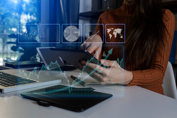 Businessman hands working on tablet computer with network and digital finance marketing chart and future technology innovation and digital transformation concept.