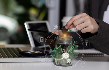  Business  hand holding coins putting in glass, saving money and finance accounting concept.