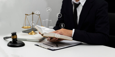 Concepts of Law and Legal services. Lawyer working with law interface icons. Blurred background.