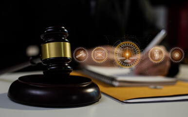 Obraz na płótnie Canvas Concepts of Law and Legal services. Lawyer working with law interface icons. Blurred background. 