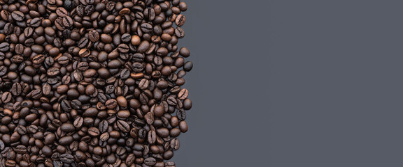 Coffee beans background.Dark roast coffee beans background, top view