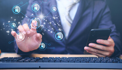 Businessman working on table with digital cybersecurity and network protection concept, Virtual...