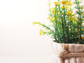 Picture of artificial plastic flower on a ceramic vase