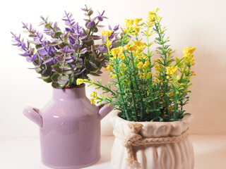 Picture of artificial plastic flower on a ceramic vase