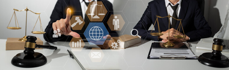 Concepts of Law and Legal services. Lawyer working with law interface icons. Blurred background.	