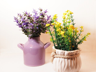 Picture of artificial plastic flower on a ceramic vase