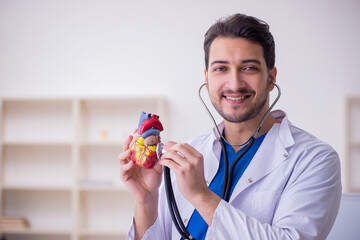 Young male doctor cardiologist in the classroom