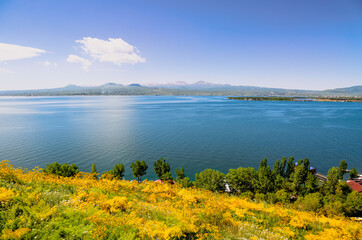 View of scenic Sevan lake in Armenia. Summertime holidays near the lake.