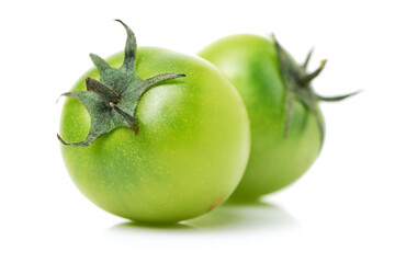 Green tomatoes on white background