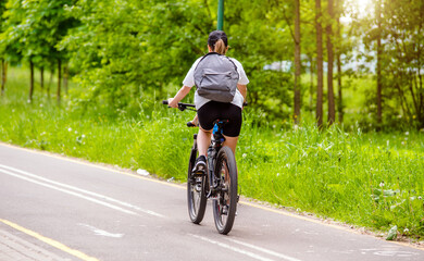 Cyclist ride on the bike path in the city Park
