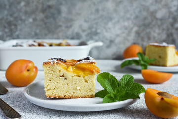 cake with apricots. Homemade pie with peaches and apricots on the kitchen table.
