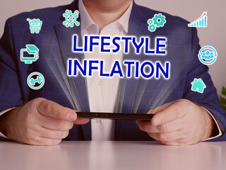  LIFESTYLE INFLATION text in search bar. Budget analyst looking for something at laptop. LIFESTYLE...