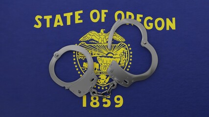 A half opened steel handcuff in center on top of the US state flag of Oregon (Front)
