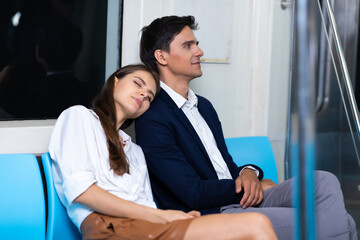 Crowd of passengers on Urban Public Transport Metro. Business people go to work by public transport. Couple in love