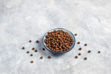 Allspice in a small bowl and spoon.