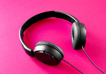 Headphones on a pink background