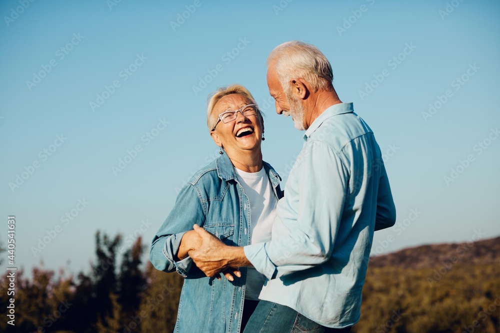 Wall mural woman man outdoor senior couple happy lifestyle retirement together smiling love old nature mature