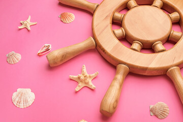 Helm and sea shells on color background