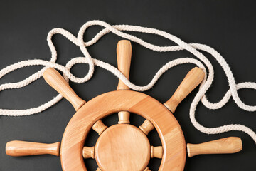 Helm and rope on dark background