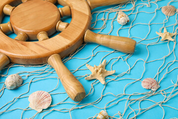 Helm, net and sea shells on color background