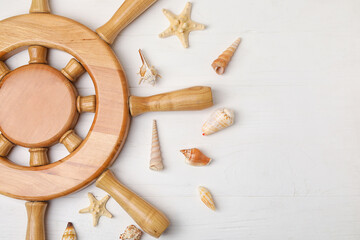Helm and sea shells on wooden background