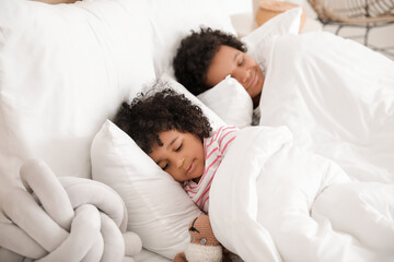 Fototapeta na wymiar African-American children lying in bed