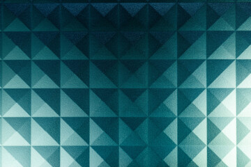 Obraz premium Geometric abstract square pattern on a piece of plastic pc component close up macro shot.