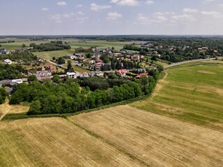 Fototapeta na wymiar Countryside, farm, fields, meadows seen from above - photo drone 