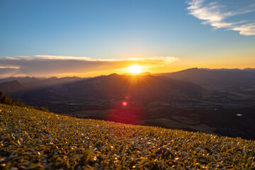 Aerial view of sunset in the french alps at camp site beside paragliding take off zone