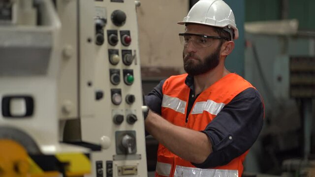 Electrician engineer checking electric cable wires in in electrical cabinet control of machine in industry factory