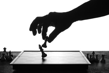 Man playing chess on white background, closeup