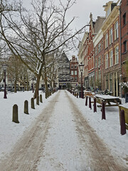 Snowy city Amsterdam in winter in the Netherlands