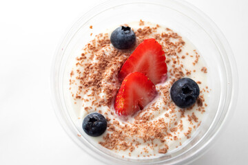 Milkshake yogurt with fresh strawberries and blueberries