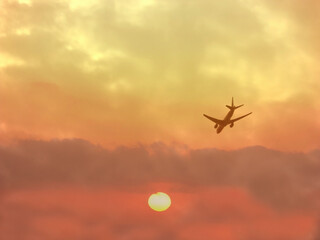 aircraft flying in to sunrise 