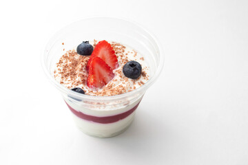 Dessert with strawberries, granola, blueberries and cottage cheese mousse