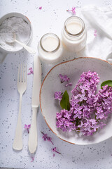Obraz na płótnie Canvas Homemade fried lilac flower in pancake dough. Summer dessert.
