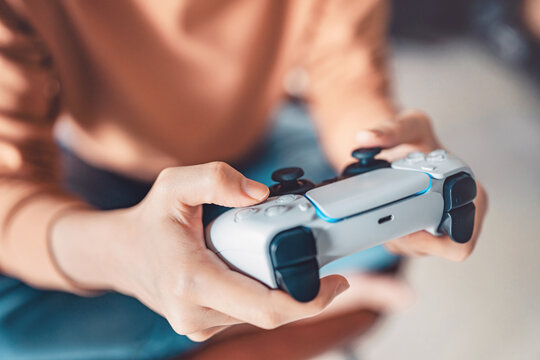 Woman hand playing a computer games with joystick