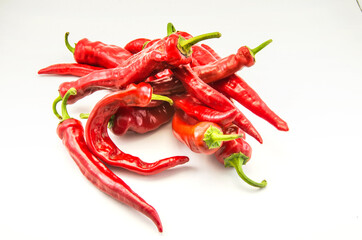 Red hot chili peppers on a white background.