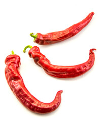 Red hot chili peppers on a white background.