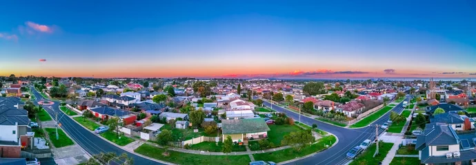 Poster Panoramic aerial Drone view of Melbournes suburbs and CBD looking down at Houses roads and Parks Victoria Australia © Elias Bitar