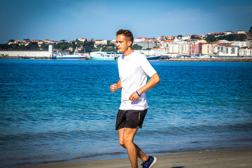 man running on the beach sand