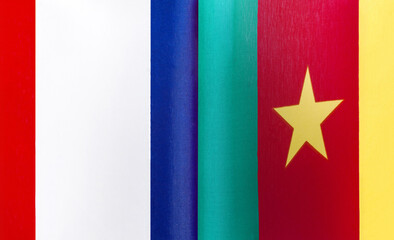 fragments of the national flags of France and the Republic of Cameroon close-up