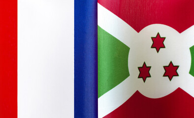 fragments of the national flags of France and the Republic of Burundi close-up
