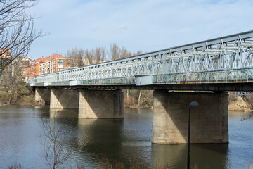Old train Iron bridge over Duero river in Zamora. Spain.