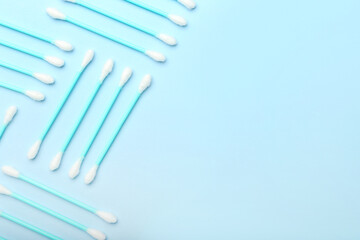 Cotton swabs on color background